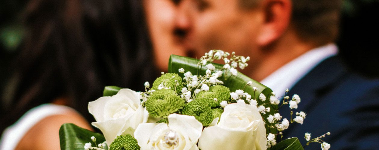 Bride & Groom with Flowers in foreground